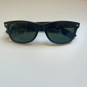 Ray-Ban RB2132 New Wayfarer sunglasses with polarized lenses.